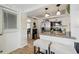 Open kitchen with granite counters, stainless steel appliances, and adjacent dining area at 4240 Woodsville Dr, New Port Richey, FL 34652