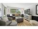 Comfortable living room with neutral color palette, contemporary furnishings, and view to backyard at 4240 Woodsville Dr, New Port Richey, FL 34652