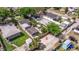 Aerial view highlighting the fenced backyard with rockscape, providing ample parking and outdoor space at 477 44Th N Ave, St Petersburg, FL 33703