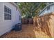 Private backyard features a new fence, rockscape, and mature landscaping, ready for your personal touch at 477 44Th N Ave, St Petersburg, FL 33703