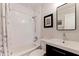 Bright bathroom with tiled shower, sleek vanity, mirror, and modern fixtures at 477 44Th N Ave, St Petersburg, FL 33703