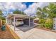 Exterior view of the house featuring a covered carport with a car parked under it at 477 44Th N Ave, St Petersburg, FL 33703