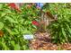 Close-up of the garden features a garden artist sign and lovely flowers in a peaceful and tranquil setting at 477 44Th N Ave, St Petersburg, FL 33703