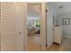 Hallway view to the living room offering wood floors, lots of storage, and decor at 477 44Th N Ave, St Petersburg, FL 33703