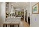 Bright kitchen with white cabinets, quartz countertops, and seating opens to the home's living room at 477 44Th N Ave, St Petersburg, FL 33703