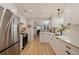 Modern kitchen featuring white cabinets, stainless steel appliances, and a stylish sink at 477 44Th N Ave, St Petersburg, FL 33703