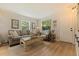 Inviting living room with a comfortable sofa, decorative artwork, and natural light at 477 44Th N Ave, St Petersburg, FL 33703