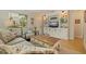 Bright living room with built-in shelving, a comfortable armchair, and hardwood floors at 477 44Th N Ave, St Petersburg, FL 33703