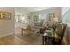 Comfortable living room featuring hardwood floors, a cozy couch, and abundant natural light at 477 44Th N Ave, St Petersburg, FL 33703