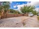 Gravel driveway with a freshly fenced area providing ample parking space, perfect for extra vehicles at 477 44Th N Ave, St Petersburg, FL 33703