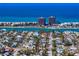 Breath-taking aerial of a neighborhood with the ocean's shoreline in the background at 500 79Th Ave, St Pete Beach, FL 33706