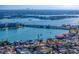 Scenic aerial view featuring a bridge over a blue bay, surrounded by lush greenery and homes at 500 79Th Ave, St Pete Beach, FL 33706