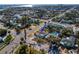An aerial view of a residential neighborhood featuring a home with a pool and a vibrant community setting at 500 79Th Ave, St Pete Beach, FL 33706