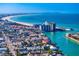 Stunning aerial view showcasing coastal homes, a bay, and a bridge at 500 79Th Ave, St Pete Beach, FL 33706