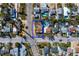 High-angle view of the property nestled in a residential area near other houses and streets at 500 79Th Ave, St Pete Beach, FL 33706