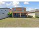 Large grass backyard with screened in patio area, great for outdoor entertaining at 5147 Brickwood Rise Dr, Wimauma, FL 33598