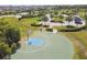 Enjoy outdoor activities with this basketball court surrounded by landscaped greenery in a Gathering-friendly neighborhood at 5147 Brickwood Rise Dr, Wimauma, FL 33598