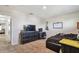 Bedroom with carpet, a dark dresser and a guitar at 5147 Brickwood Rise Dr, Wimauma, FL 33598