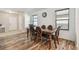 Charming dining area featuring wood-look floors and natural light, perfect for Gathering meals at 5147 Brickwood Rise Dr, Wimauma, FL 33598