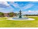 A decorative water fountain enhances the property's curb appeal and adds a touch of elegance at 5147 Brickwood Rise Dr, Wimauma, FL 33598