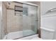 The bathroom includes a shower and bathtub combination with a glass shower door at 5310 Bellefield Dr, Tampa, FL 33624