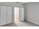 This bedroom features neutral carpet and a closet at 5310 Bellefield Dr, Tampa, FL 33624