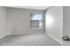 This bedroom has a window and neutral carpet at 5310 Bellefield Dr, Tampa, FL 33624