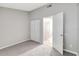 This bedroom features neutral carpet and a closet at 5310 Bellefield Dr, Tampa, FL 33624