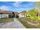 Charming single-story villa with landscaped front yard and inviting walkway at 5310 Bellefield Dr, Tampa, FL 33624
