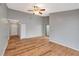 Spacious living room featuring laminate flooring, ceiling fan, and sliding door to a patio at 5310 Bellefield Dr, Tampa, FL 33624