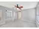 Large main bedroom featuring neutral carpeting, a ceiling fan, and large closet at 5310 Bellefield Dr, Tampa, FL 33624