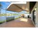 Enjoy serene water views from this inviting screened-in patio, ideal for outdoor gatherings and leisure at 5310 Bellefield Dr, Tampa, FL 33624