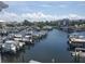 Picturesque aerial view of the marina, showing numerous boats and waterfront homes at 5712 Biscayne Ct # 203, New Port Richey, FL 34652