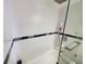 Bathroom with walk-in shower, glass screen, rain head and modern fixtures at 5712 Biscayne Ct # 203, New Port Richey, FL 34652