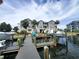 Condominium buildings are shown behind boats and docks at 5712 Biscayne Ct # 203, New Port Richey, FL 34652