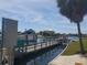 Beautiful waterfront view from the property's dock and pier with tropical foliage at 5712 Biscayne Ct # 203, New Port Richey, FL 34652