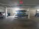 Parking garage featuring a kayak storage rack and vehicle parking at 5712 Biscayne Ct # 203, New Port Richey, FL 34652