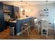 Open kitchen featuring stainless steel appliances, breakfast bar, and adjacent dining area at 5712 Biscayne Ct # 203, New Port Richey, FL 34652