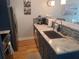 Modern kitchen with granite countertops, stainless steel appliances, and mosaic backsplash at 5712 Biscayne Ct # 203, New Port Richey, FL 34652