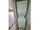 Modern stackable washer and dryer hidden from view, maximizing space at 5712 Biscayne Ct # 203, New Port Richey, FL 34652