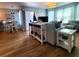 Bright living room with wood floors, comfortable seating, and stylish nautical accents at 5712 Biscayne Ct # 203, New Port Richey, FL 34652