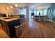 Bright open-concept living space with modern decor and hardwood floors at 5712 Biscayne Ct # 203, New Port Richey, FL 34652