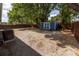 Large backyard featuring shed, mature trees, and partial fencing at 5806 12Th S Ave, Tampa, FL 33619