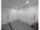 Finished basement space with freshly painted block walls and flooring at 5806 12Th S Ave, Tampa, FL 33619