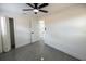 Spacious bedroom features modern flooring and a ceiling fan with views to the hallway and other rooms at 5806 12Th S Ave, Tampa, FL 33619