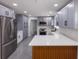 Modern kitchen with gray cabinets, stainless steel appliances, and quartz countertops at 5806 12Th S Ave, Tampa, FL 33619