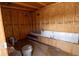 Interior view of the shed with wooden walls, framing, and building supplies on the floor at 5806 12Th S Ave, Tampa, FL 33619