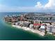 Aerial view of a coastal community with beach and waterfront condos at 600 Bayway Blvd # 504, Clearwater Beach, FL 33767