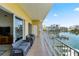 Relax on the spacious balcony with seating, offering panoramic views of the waterfront and city at 600 Bayway Blvd # 504, Clearwater Beach, FL 33767