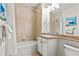 Bathroom featuring a tub, vanity and shower at 600 Bayway Blvd # 504, Clearwater Beach, FL 33767